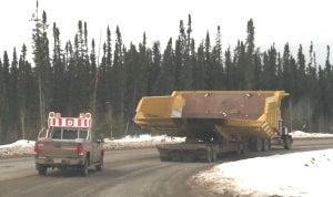 Off-highway truck body for hauling oil sands