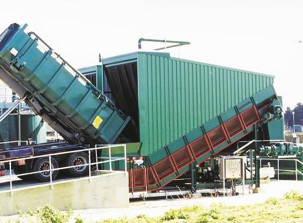 Samson® Material Feeder taking over bulk materials from truck.